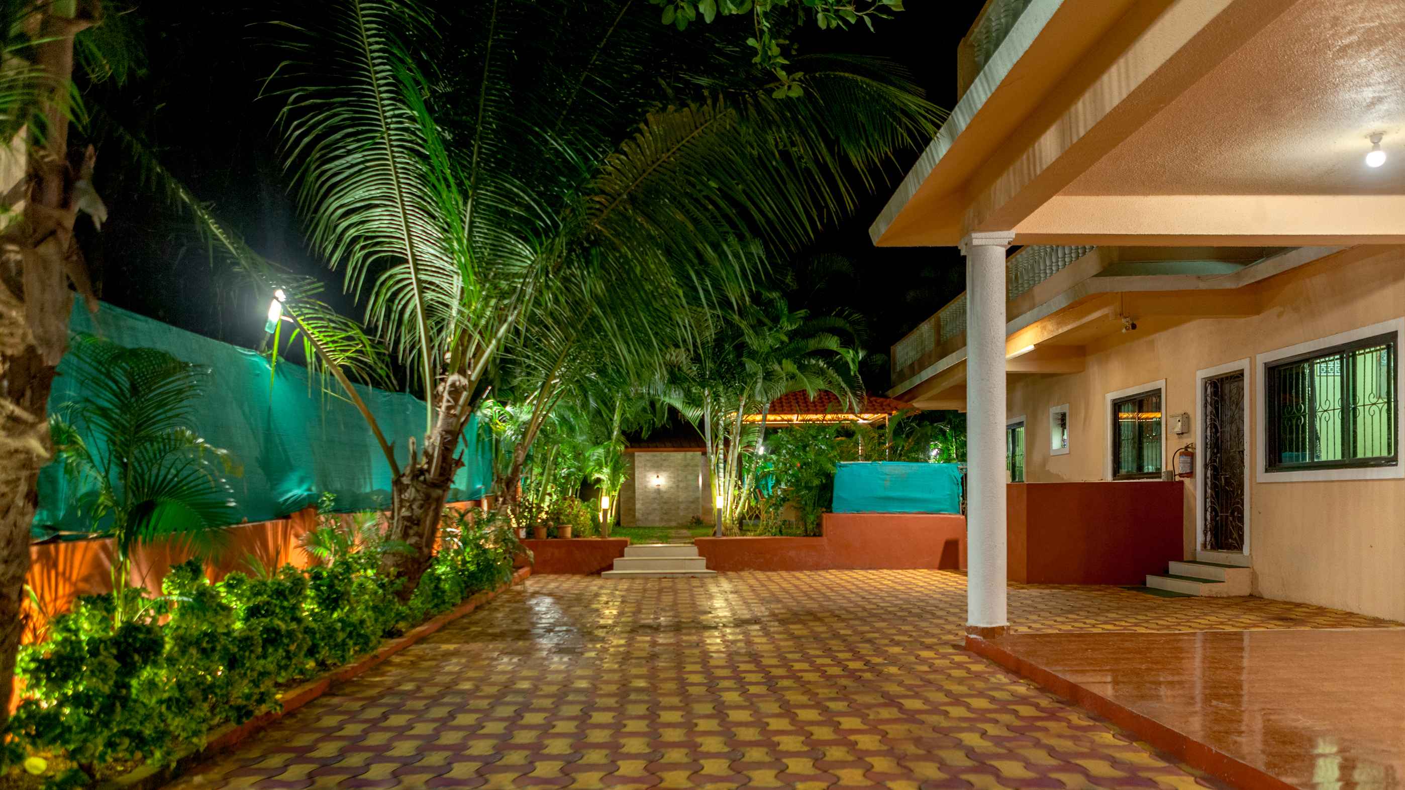 Arovana Villa in Goa featuring a luxury private swimming pool, tropical garden seating area, and premium villa stay experience.