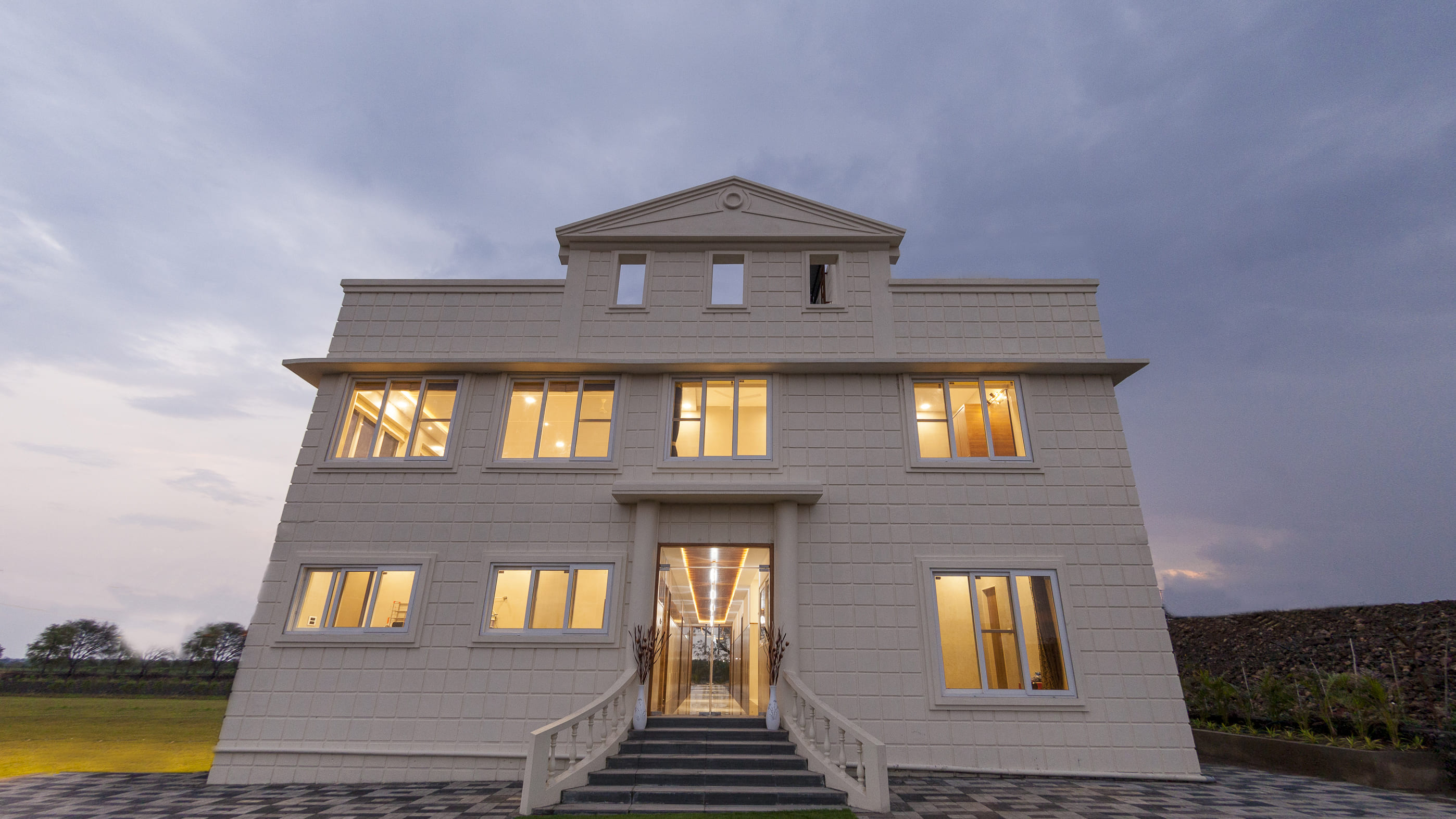 Front facade of The Arowana Divine, best villa in Nanded with hotel rooms in Nanded