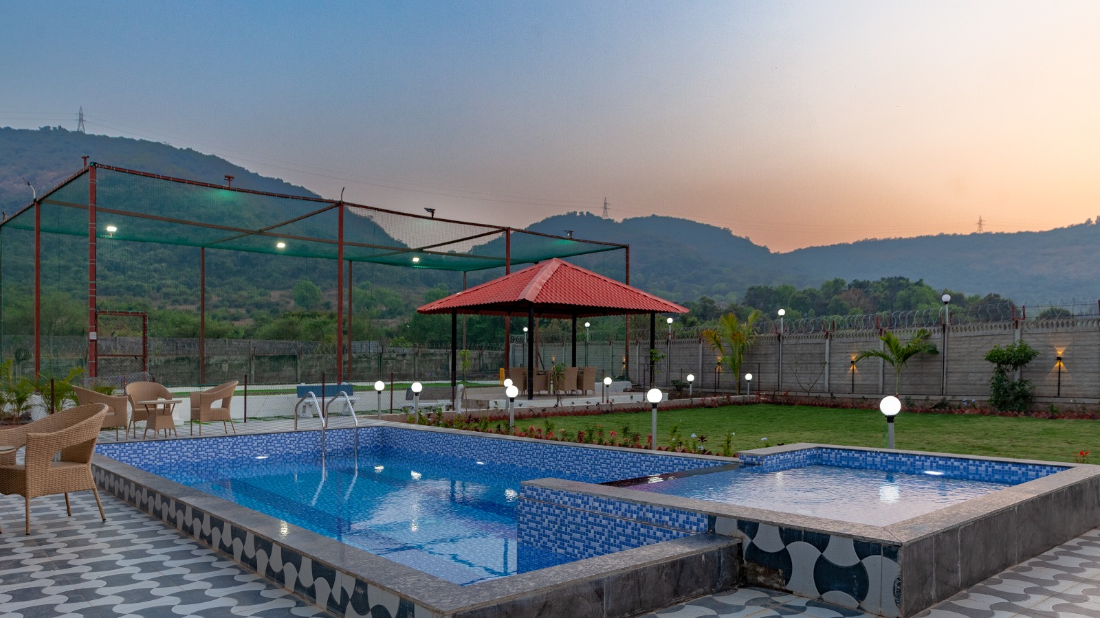 Arowana villa in Lonavala with private pool, gazebo, and Sahyadri mountain views at sunset