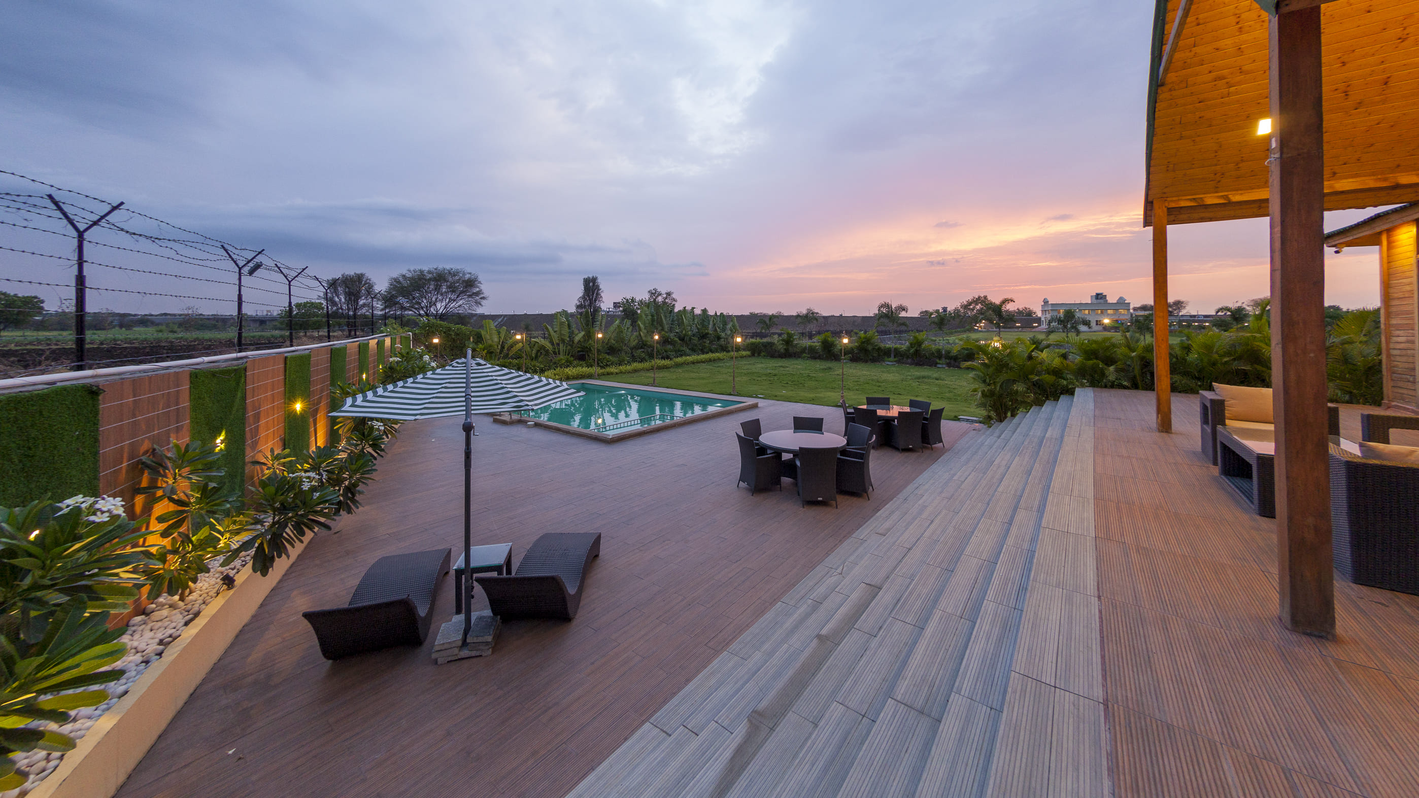 Arowana Villa luxury poolside stay near Nanded Hills hotel for rent with private swimming pool, outdoor seating, and sunset view.